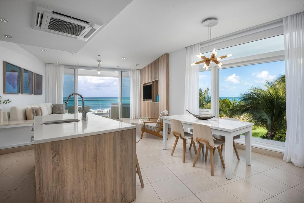 Wymara Unit 1308/09 modern kitchen and dining area with ocean view, Grace Bay, Turks and Caicos