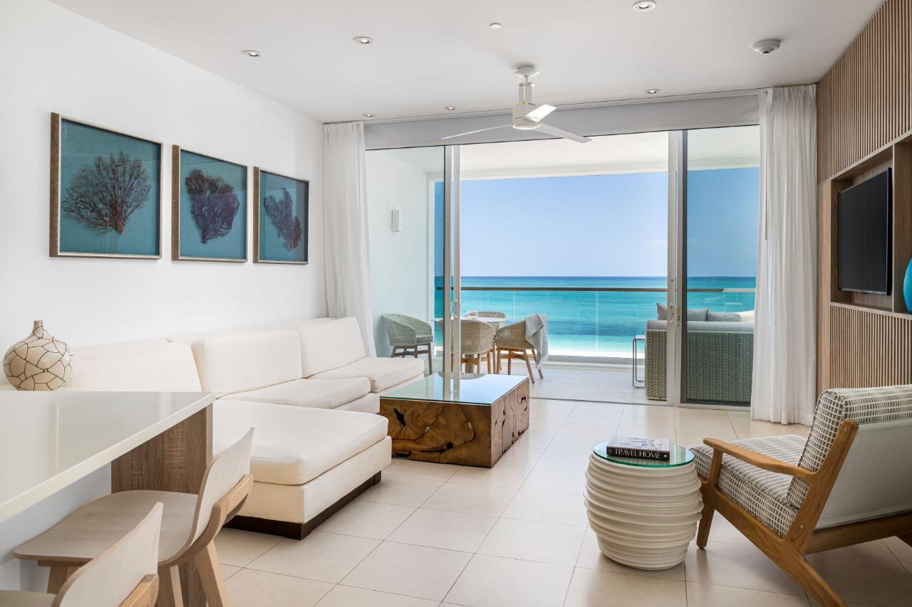 Wymara Unit 1308/09 living room with oceanfront balcony view, Grace Bay, Turks and Caicos